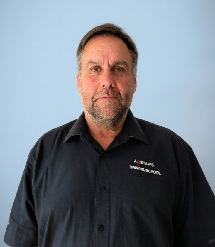 A headshot image of Alistair